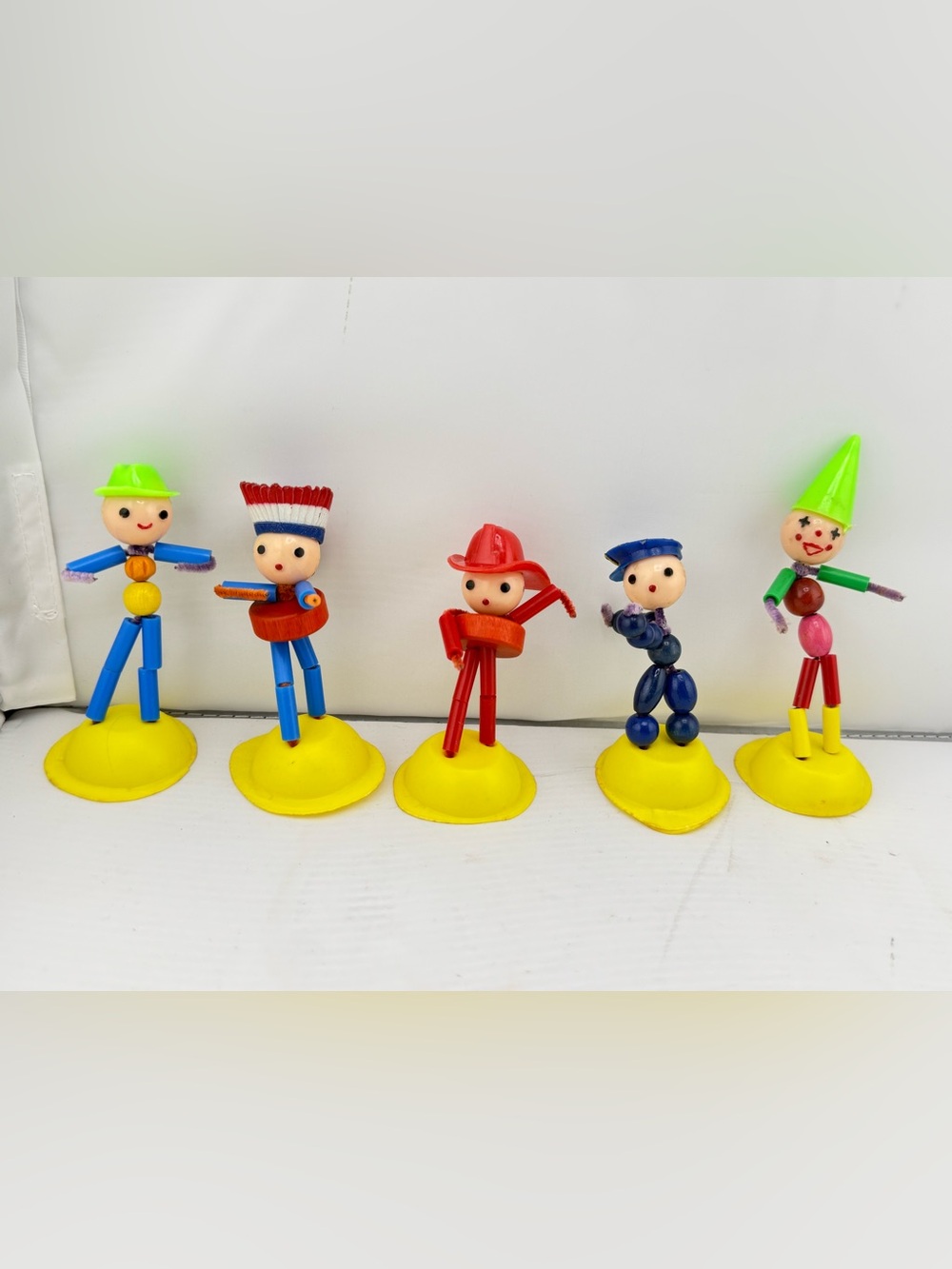 Vintage wooden bead and pipe cleaner dolls